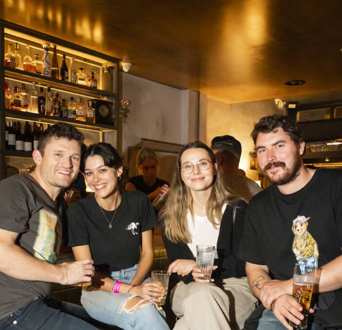 Keith O'Neil shares a drink with friends at Swan St's Blacksmith Bar 