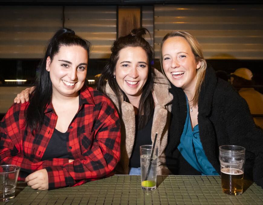 Jess, Tash Davies and Eliza Ogg ready for some ribs at the National Hotel, in Victoria St
