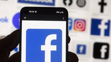 Regulators in the UK want social media platforms to filter out harmful content to protect children. (AP PHOTO)