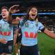 Blues' Jarome Luai (R) and Mitchell Moses are ecstatic after their State of Origin III victory. Photo: Dave Hunt/AAP PHOTOS