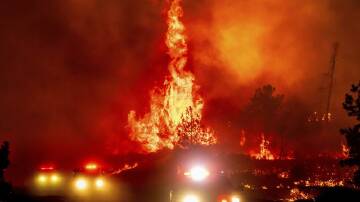 The Park Fire was advancing up to 20 square kilometres an hour on Friday, authorities said. Photo: AP PHOTO